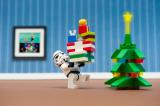 Storm trooper holding Christmas presents