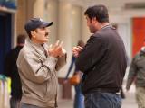 Two men talking on the street