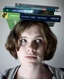 Woman with textbooks on her head