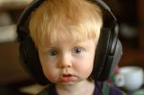 Child listening to headphones