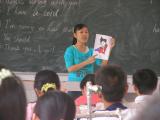 Woman in front of classroom